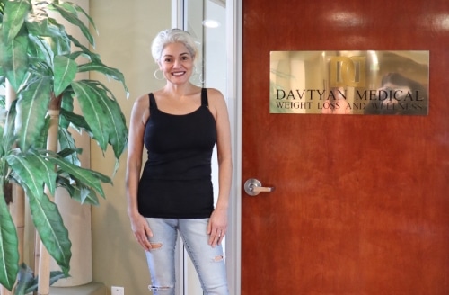 A smiling patient after weight loss surgery at Dr. Davtyan's technologically advanced bariatric surgery center.